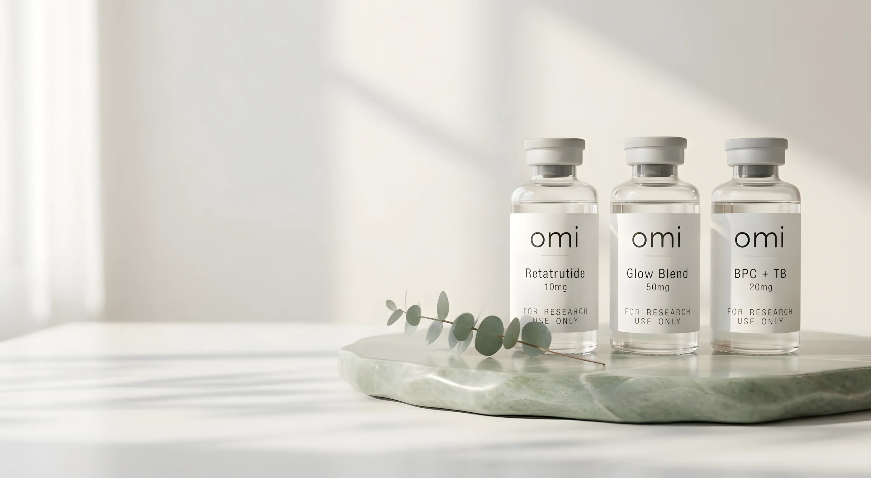 omi research peptide vials on a sage stone slab